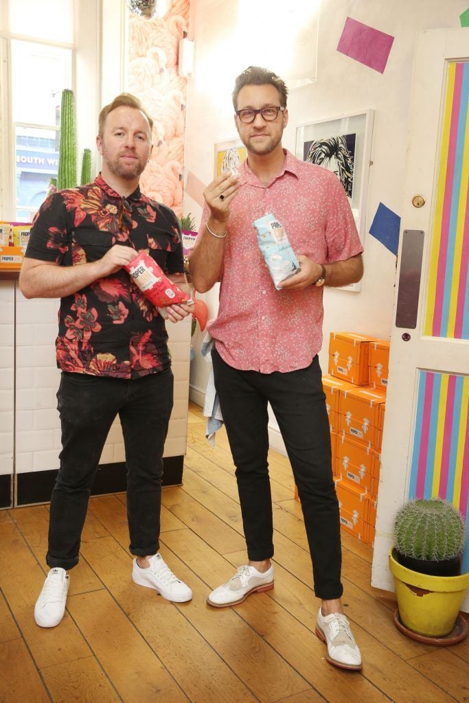 Ciaran McGonagle and Federico Riezzo at the launch of Propercorn's new Find Your Flavour nail art menu at Tropical Popical, which features designs inspired by the colours and illustrations of the six Propercorn flavours. Photo: Leon Farrell/Photocall Ireland.
