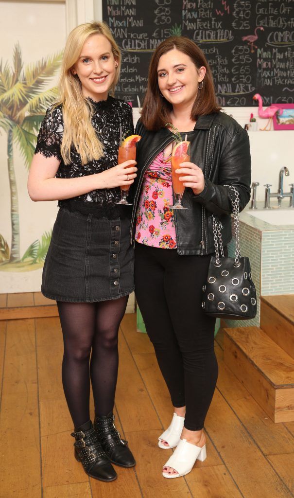 Alana Laverty and Joan Hughes at the launch of Propercorn's new Find Your Flavour nail art menu at Tropical Popical, which features designs inspired by the colours and illustrations of the six Propercorn flavours. Photo: Leon Farrell/Photocall Ireland.