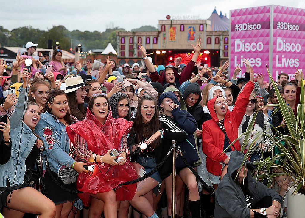 Fand brave the rain to watch Internet sensations James Kavanagh  and Doireann Garrihy as they took part   in the Ultimate #3disco Lip-sync Showdown at the #3Disco area at the sold-out three-day festival Electric Picnic at Stradbally, Co. Laois. Picture: Brian McEvoy