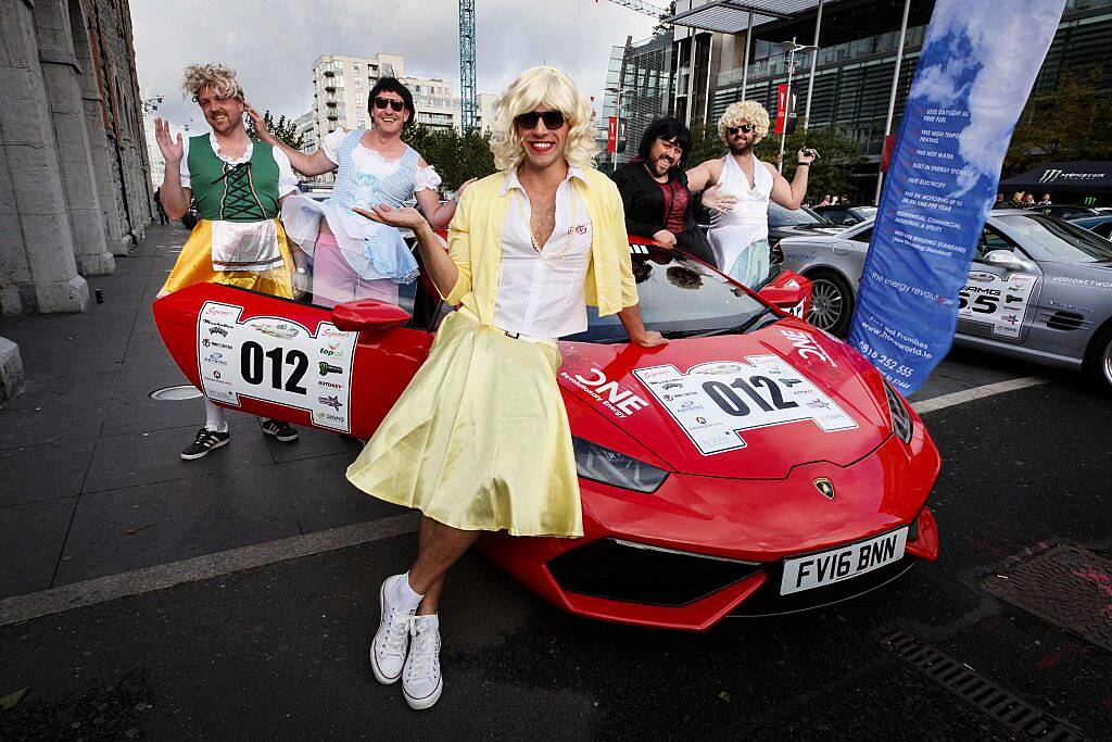 Wes Quirke (centre) and friends (back from left) Mark Doyle, John Faley, David Knight and Geoff Ledwidge, dressed to impress at the start line of the supercar spectacle Cannonball 2017 in the Point Village, Dublin (8th September 2017). Picture by Andres Poveda