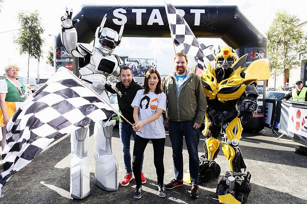 2FM's Keith Walsh, Jennifer Zamparelli and Bernard O'Shea at the start line of the supercar spectacle Cannonball 2017 in the Point Village, Dublin (8th September 2017). Picture by Andres Poveda