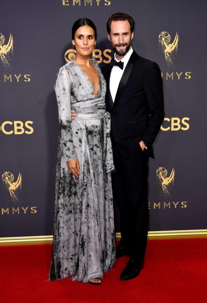 LOS ANGELES, CA - SEPTEMBER 17:  Actors Maria Dolores Dieguez (L) and Joseph Fiennes attend the 69th Annual Primetime Emmy Awards at Microsoft Theater on September 17, 2017 in Los Angeles, California.  (Photo by Frazer Harrison/Getty Images)