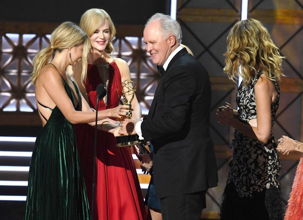 LOS ANGELES, CA - SEPTEMBER 17:  Actor John Lithgow (C) accepts Outstanding Supporting Actor in a Drama Series for 'The Crown' from actors (L-R) Shailene Woodley, Nicole Kidman and Laura Dern onstage during the 69th Annual Primetime Emmy Awards at Microsoft Theater on September 17, 2017 in Los Angeles, California.  (Photo by Kevin Winter/Getty Images)