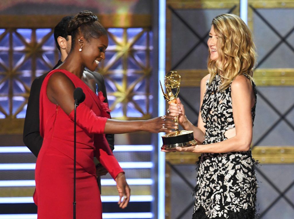 LOS ANGELES, CA - SEPTEMBER 17:  Actor Laura Dern (R) accepts Outstanding Supporting Actress in a Limited Series or Movie for 'Big Little Lies' from actor Issa Rae onstage during the 69th Annual Primetime Emmy Awards at Microsoft Theater on September 17, 2017 in Los Angeles, California.  (Photo by Kevin Winter/Getty Images)