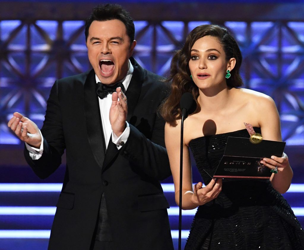 LOS ANGELES, CA - SEPTEMBER 17:  Actor/producer Seth MacFarlane (L) and actor Emmy Rossum speak onstage during the 69th Annual Primetime Emmy Awards at Microsoft Theater on September 17, 2017 in Los Angeles, California.  (Photo by Kevin Winter/Getty Images)