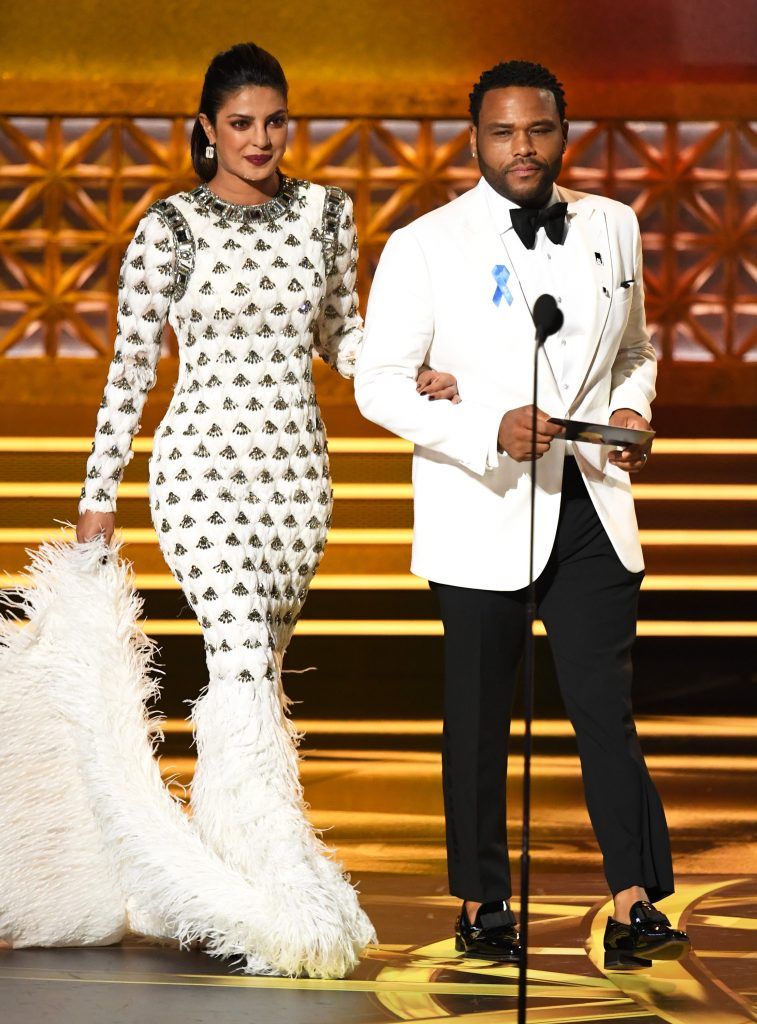 LOS ANGELES, CA - SEPTEMBER 17:  Actors Priyanka Chopra and Anthony Anderson walk onstage during the 69th Annual Primetime Emmy Awards at Microsoft Theater on September 17, 2017 in Los Angeles, California.  (Photo by Kevin Winter/Getty Images)