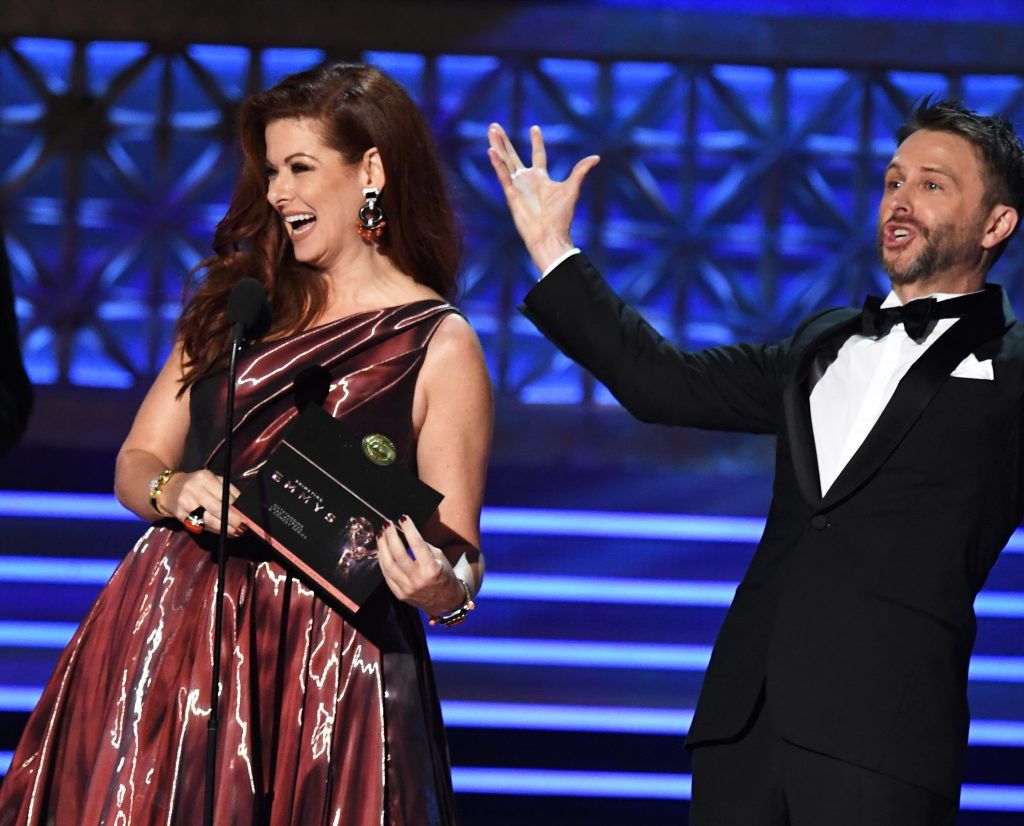 LOS ANGELES, CA - SEPTEMBER 17:  Actor Debra Messing and TV personality Chris Hardwick speak onstage during the 69th Annual Primetime Emmy Awards at Microsoft Theater on September 17, 2017 in Los Angeles, California.  (Photo by Kevin Winter/Getty Images)