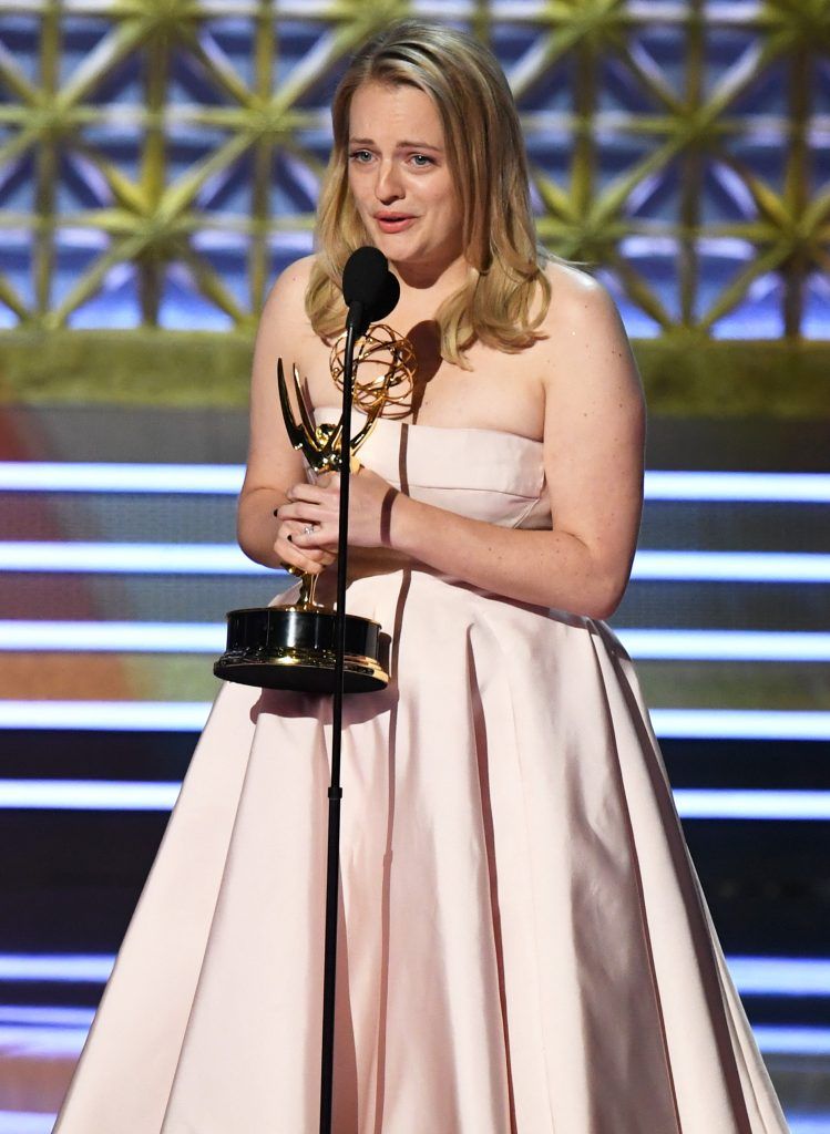 LOS ANGELES, CA - SEPTEMBER 17:  Actor Elisabeth Moss accepts Outstanding Lead Actress in a Drama Series for 'The Handmaid's Tale' onstage during the 69th Annual Primetime Emmy Awards at Microsoft Theater on September 17, 2017 in Los Angeles, California.  (Photo by Kevin Winter/Getty Images)