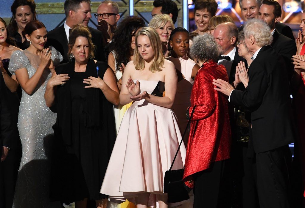 LOS ANGELES, CA - SEPTEMBER 17:  Actor Elisabeth Moss (L) and author Margaret Atwood with cast and crew of 'The Handmaid's Tale' accept the Outstanding Drama Series award onstage during the 69th Annual Primetime Emmy Awards at Microsoft Theater on September 17, 2017 in Los Angeles, California.  (Photo by Kevin Winter/Getty Images)