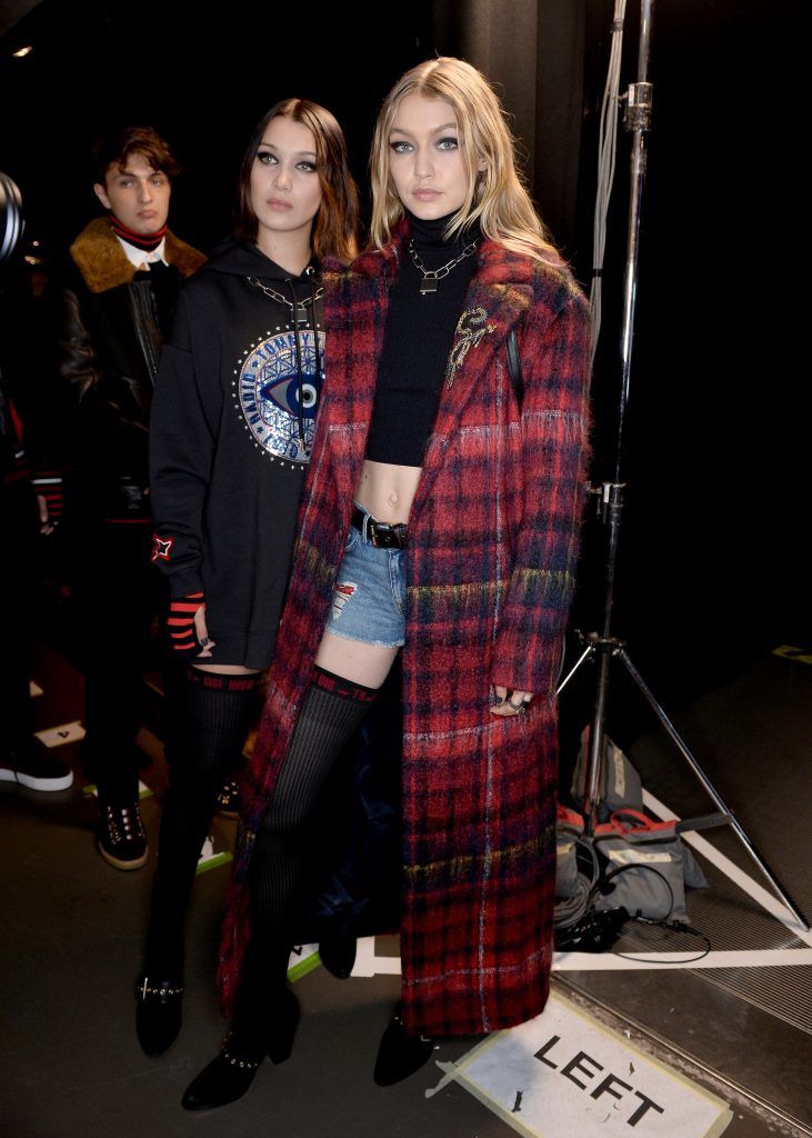 Bella Hadid and Gigi Hadid are seen backstage ahead of the Tommy Hilfiger TOMMYNOW Fall 2017 Show during London Fashion Week September 2017 at the Roundhouse on September 19, 2017 in London, England.  (Photo by Jeff Spicer/Getty Images for Tommy Hilfiger)