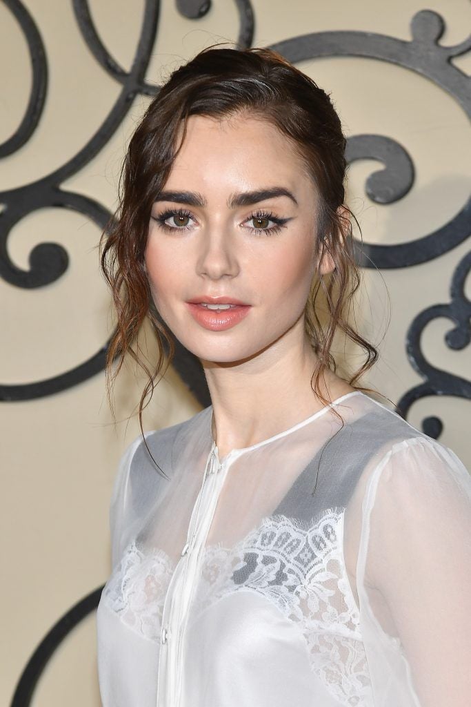 Lily Collins attends the Givenchy show as part of the Paris Fashion Week Womenswear  Spring/Summer 2018 on October 1, 2017 in Paris, France.  (Photo by Pascal Le Segretain/Getty Images)