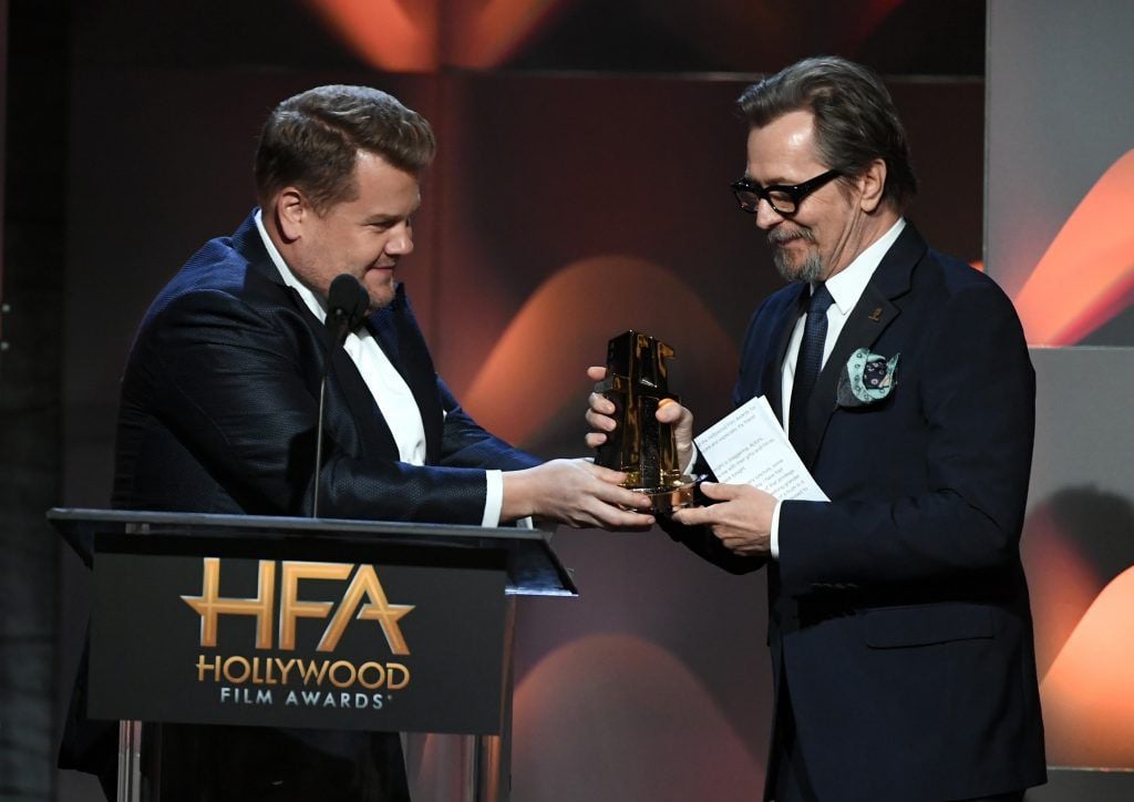 Honoree Gary Oldman (R) accepts the Hollywood Career Achievement Award from host James Corden onstage during the 21st Annual Hollywood Film Awards at The Beverly Hilton Hotel on November 5, 2017 in Beverly Hills, California.  (Photo by Kevin Winter/Getty Images)