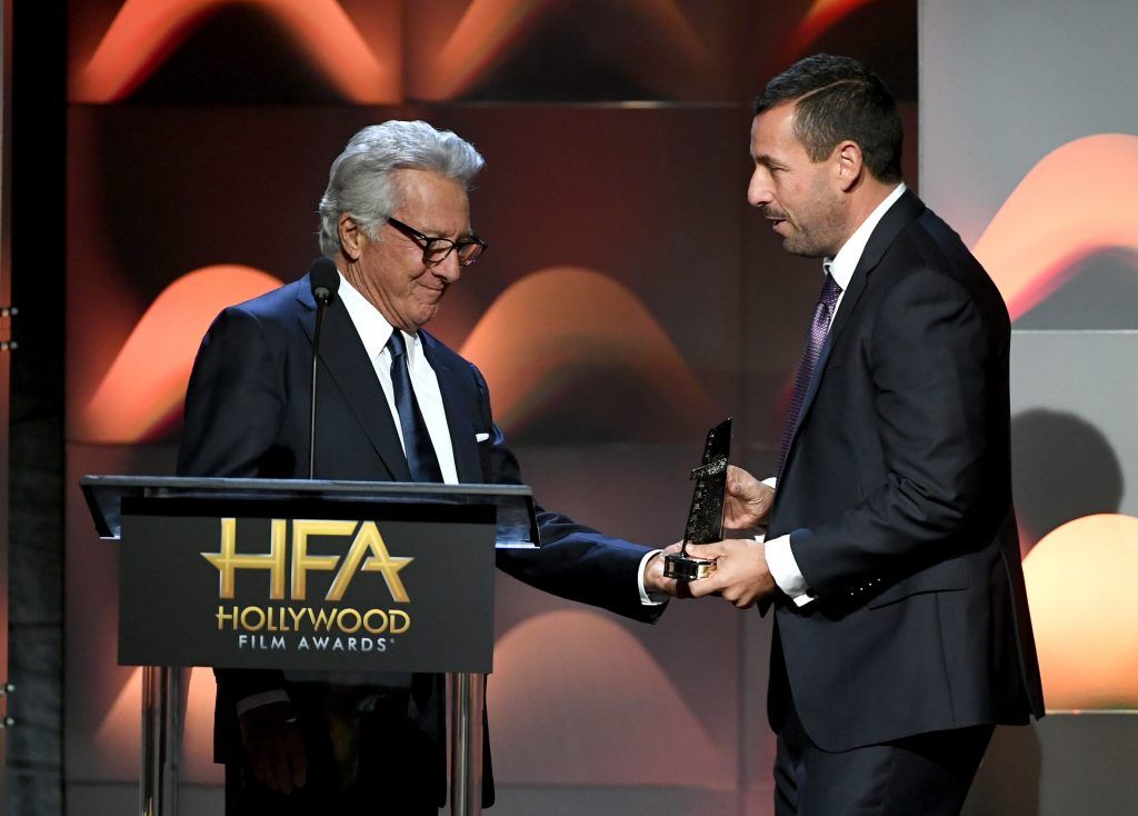 Honoree Adam Sandler (R) accepts the Hollywood Comedy Award for 'The Meyerowitz Stories' from actor Dustin Hoffman onstage during the 21st Annual Hollywood Film Awards at The Beverly Hilton Hotel on November 5, 2017 in Beverly Hills, California.  (Photo by Kevin Winter/Getty Images)