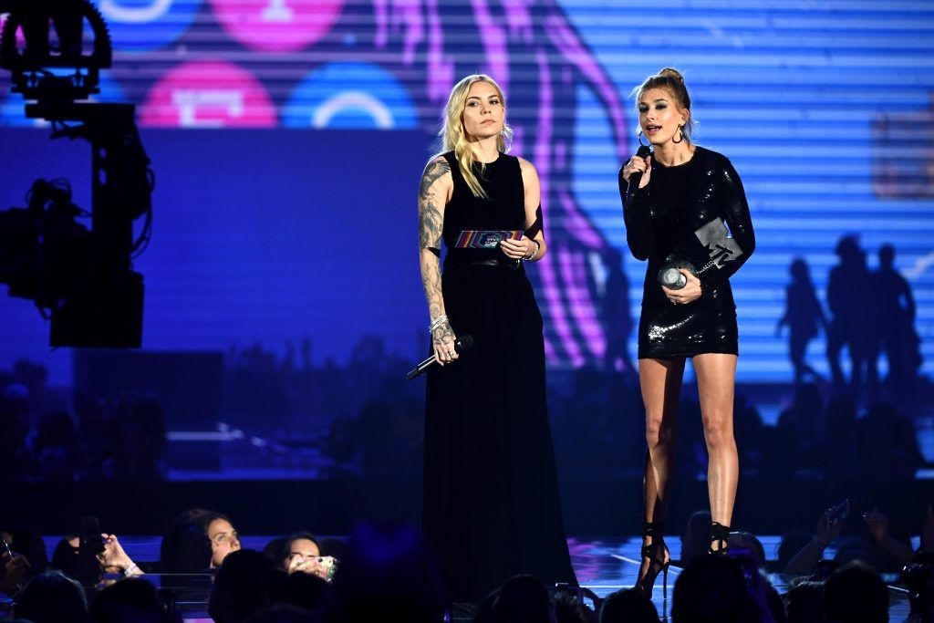 Skylar Grey (L) and Hailey Baldwin present the award for Best Video on stage during the MTV EMAs 2017 held at The SSE Arena, Wembley on November 12, 2017 in London, England.  (Photo by Ian Gavan/Getty Images for MTV)