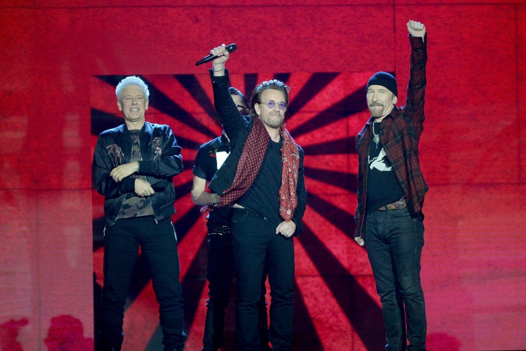 Irish rock band U2, Bono (2R), The Edge (R), Adam Clayton (L) and Larry Mullen Jr (2L), accept the global icon award on stage during the MTV EMAs 2017 held at The SSE Arena, Wembley on November 12, 2017 in London, England.  (Photo by Dave J Hogan/Dave J Hogan/Getty Images for MTV)