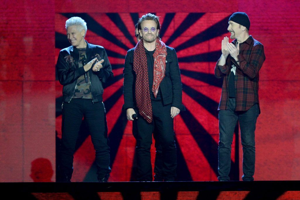 Irish rock band U2, Bono (2R), The Edge (R), Adam Clayton (L) and Larry Mullen Jr (2L), accept the global icon award on stage during the MTV EMAs 2017 held at The SSE Arena, Wembley on November 12, 2017 in London, England.  (Photo by Dave J Hogan/Dave J Hogan/Getty Images for MTV)