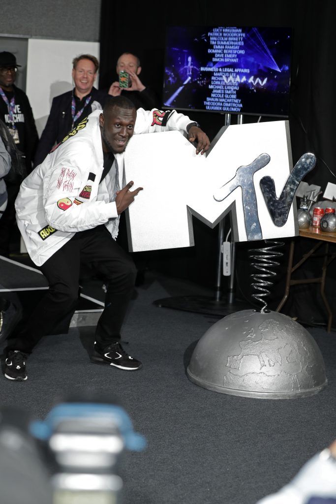 Rapper Stormzy poses with the award for the UK and Ireland Worldwide Act in the Winners Room during the MTV EMAs 2017 held at The SSE Arena, Wembley on November 12, 2017 in London, England.  (Photo by John Phillips/Getty Images for MTV)