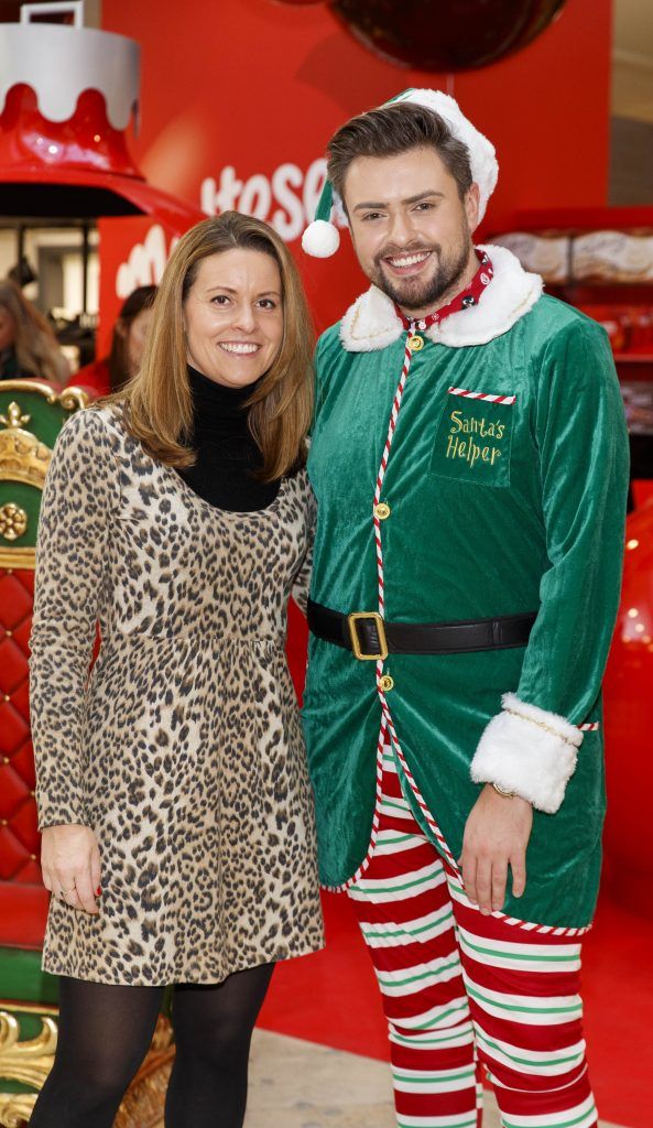 The Maltesers Elf (James Butler) is pictured with Sarah Williams at the launch of Maltesers first ever Christmas Pop-Up in Arnott's, open until December 24th 2017. Picture: Andres Poveda