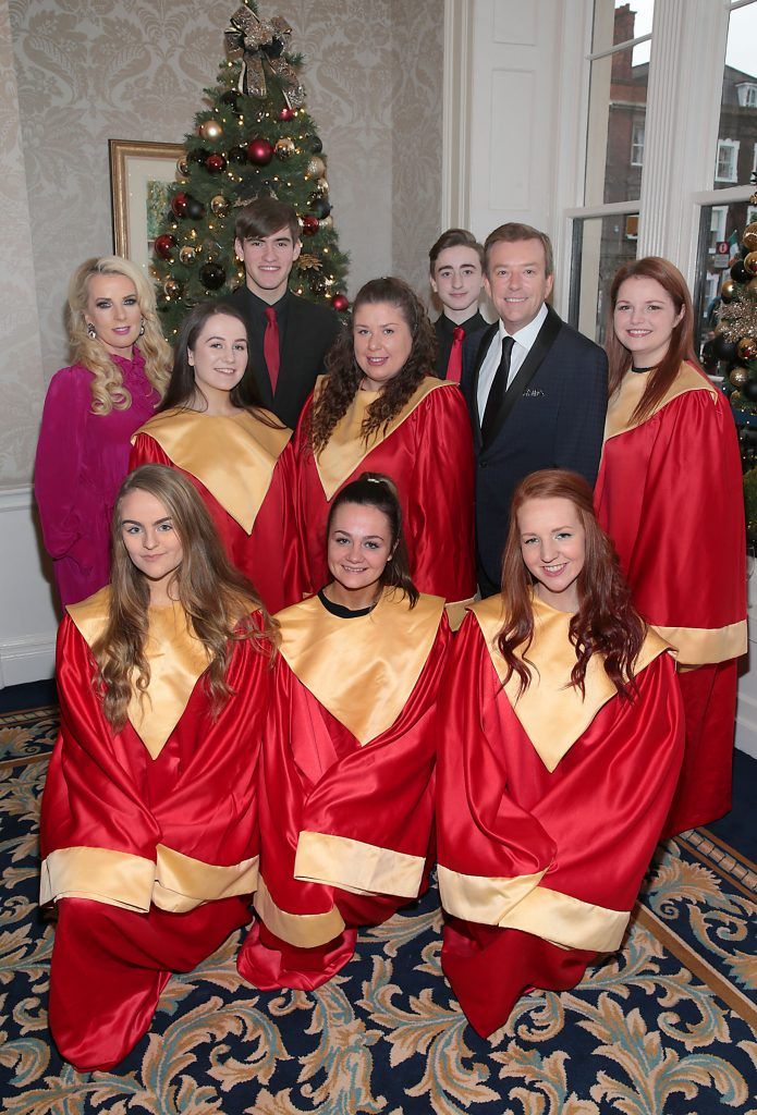 Roz Flanagan and Alan Hughes with the Halleluia Gospel Choir at the annual Cari Charity Christmas lunch hosted by Miriam Ahern at the Shelbourne Hotel Dublin. Photo: Brian McEvoy