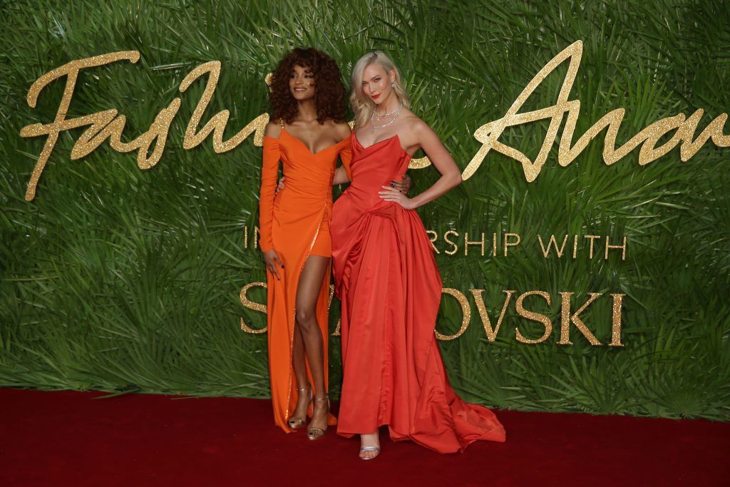 British model Jordan Dunn and American model Karlie Kloss pose on the red carpet upon arrival to attend the British Fashion Awards 2017 in London on December 4, 2017. (Photo by Daniel Leal-Olivas/AFP/Getty Images)