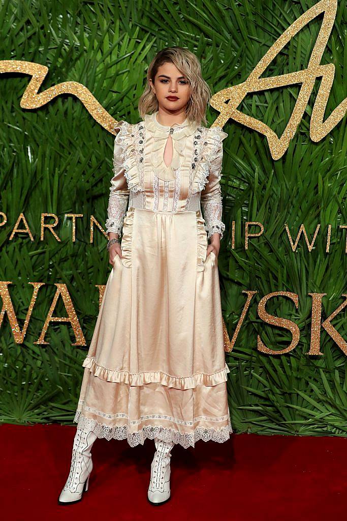 American actress Selena Gomez poses on the red carpet upon arrival to attend the British Fashion Awards 2017 in London on December 4, 2017. (Photo by DANIEL LEAL-OLIVAS/AFP/Getty Images)