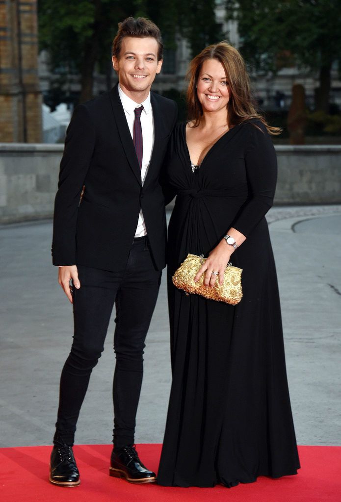 LONDON, ENGLAND - AUGUST 10:  Louis Tomlinson and Johannah Poulston attend the Believe in Magic Cinderella Ball at Natural History Museum on August 10, 2015 in London, England.  (Photo by Stuart C. Wilson/Getty Images)