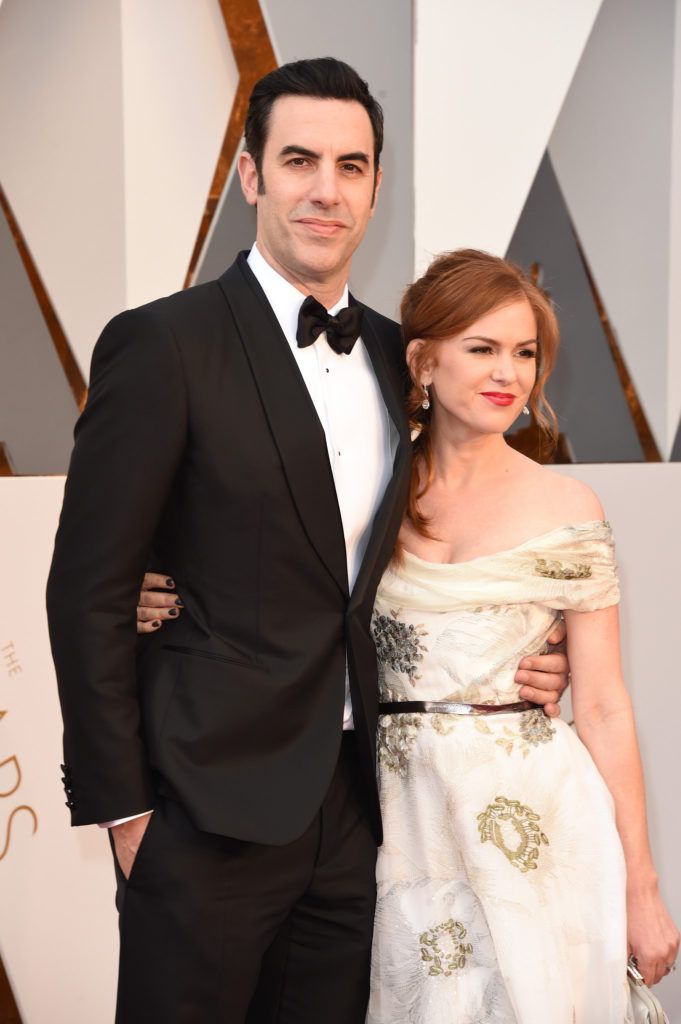 HOLLYWOOD, CA - FEBRUARY 28:  Actors Sacha Baron Cohen (L) and Isla Fisher attend the 88th Annual Academy Awards at Hollywood & Highland Center on February 28, 2016 in Hollywood, California.  (Photo by Jason Merritt/Getty Images)