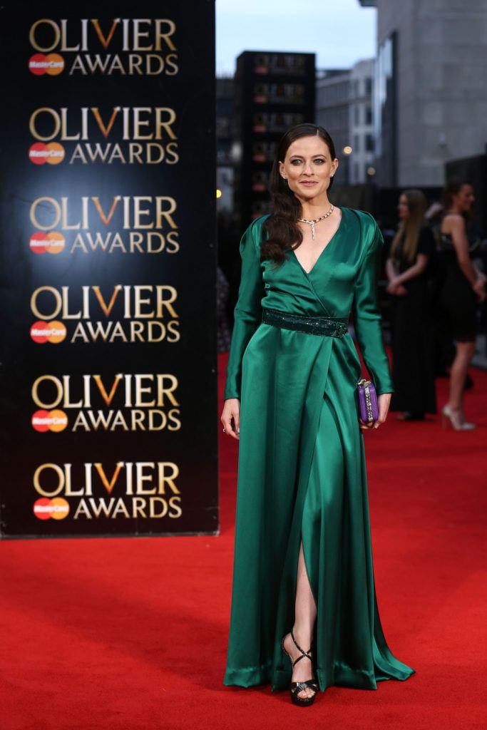 British actress Lara Pulver poses on the red carpet upon arrival to attend the 2016  Laurence Olivier Awards in London on April 3, 2016. / AFP / JUSTIN TALLIS        (Photo credit should read JUSTIN TALLIS/AFP/Getty Images)