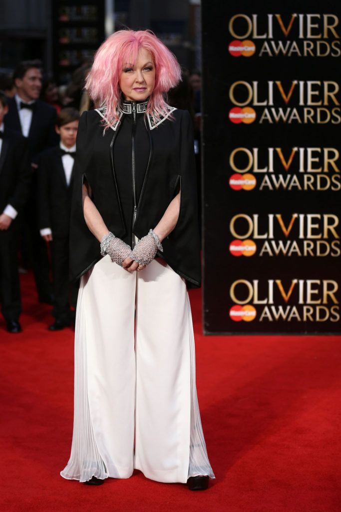 US singer Cyndi Lauper poses on the red carpet upon arrival to attend the 2016  Laurence Olivier Awards in London on April 3, 2016. / AFP / JUSTIN TALLIS        (Photo credit should read JUSTIN TALLIS/AFP/Getty Images)