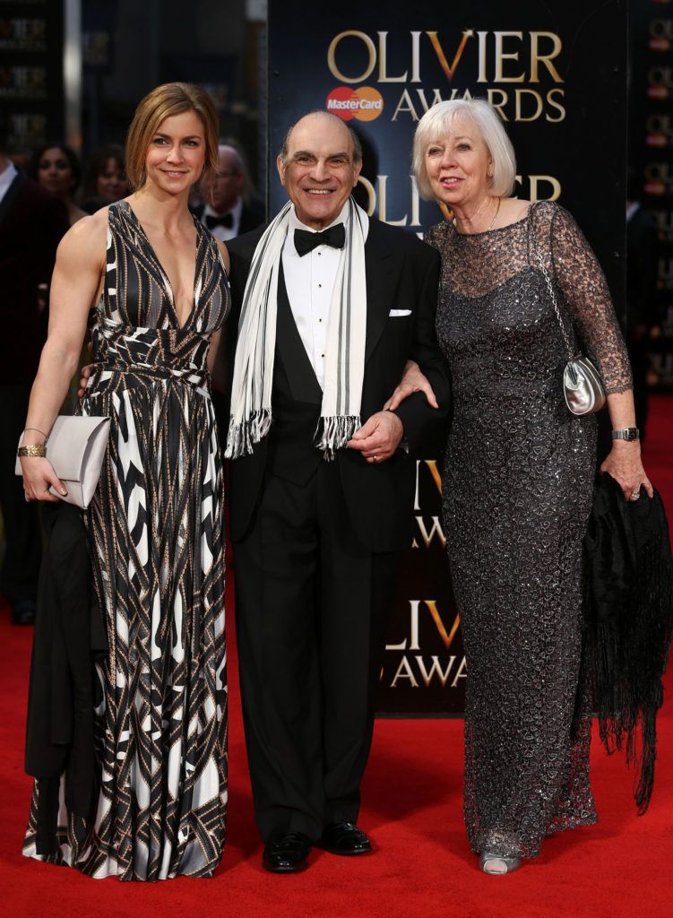 British actor David Suchet (C) poses with his wife Sheila Ferris and daughter Katherine (L) on the red carpet upon arrival to attend the 2016  Laurence Olivier Awards in London on April 3, 2016. / AFP / JUSTIN TALLIS        (Photo credit should read JUSTIN TALLIS/AFP/Getty Images)