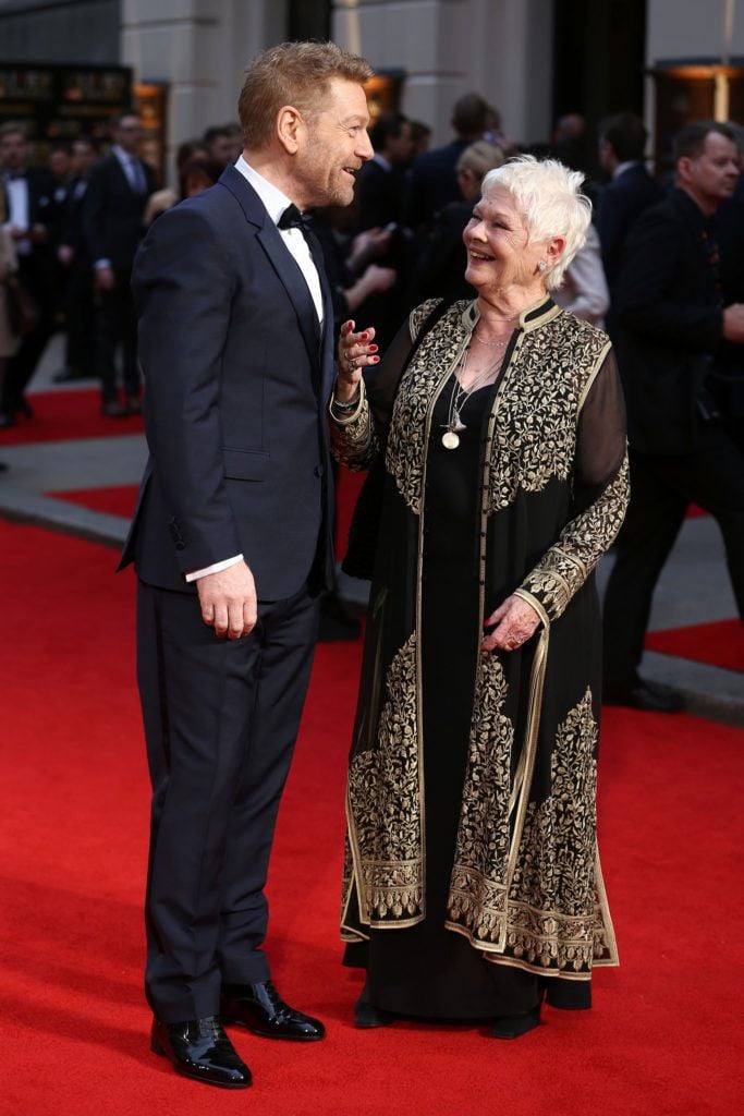 British actor and director Kenneth Branagh (L) and British actress Judi Dench (R) pose on the red carpet upon arrival to attend the 2016  Laurence Olivier Awards in London on April 3, 2016. / AFP / JUSTIN TALLIS        (Photo credit should read JUSTIN TALLIS/AFP/Getty Images)