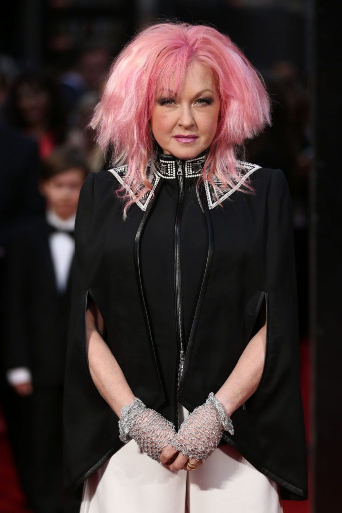 US singer Cyndi Lauper poses on the red carpet upon arrival to attend the 2016  Laurence Olivier Awards in London on April 3, 2016. / AFP / JUSTIN TALLIS        (Photo credit should read JUSTIN TALLIS/AFP/Getty Images)