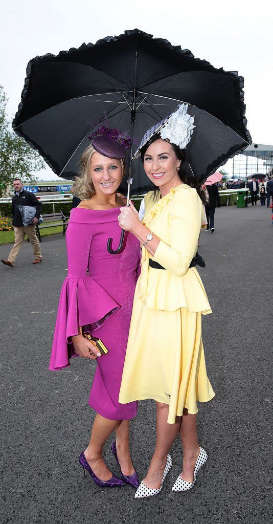 Ann Marie Hodnett and Lisa Brennan wearing creations by Phoenix V brave the showers at the Killashee Irish Tatler Style Icon competition at The 1000 Guineas at the Curragh Racecouse,Kildare.  Celebrity judge Yvonne Connolly joined Ciara McElligott of Killashee Hotel and publishing entrepreneur Norah Casey in the search for the ultimate iconic male and female looks from the race day punters. ..Picture Brian McEvoy.