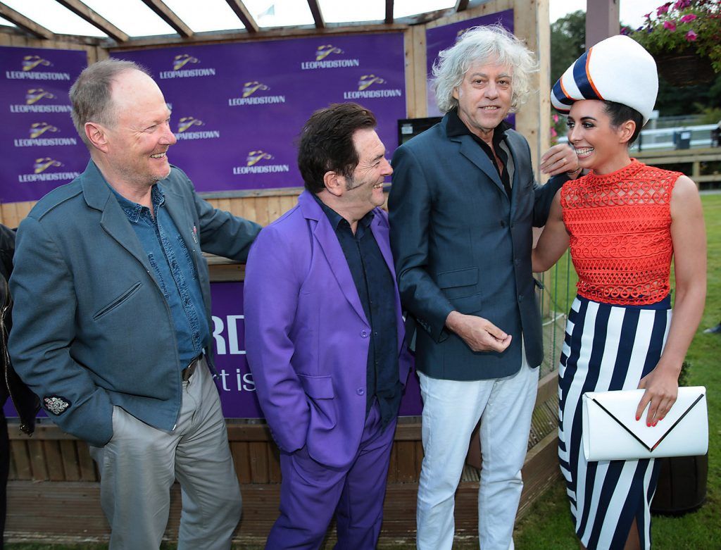 Bob Geldof  and members of The Boomtown Rats congratulate winner of best dressed Bernadette Ni Chadhain from Galway at the final of The Beacon Hotel's Dare to be Different Best Dressed Competition at The Leopardstown Evening Race meeting. (Photo by Brian McEvoy)