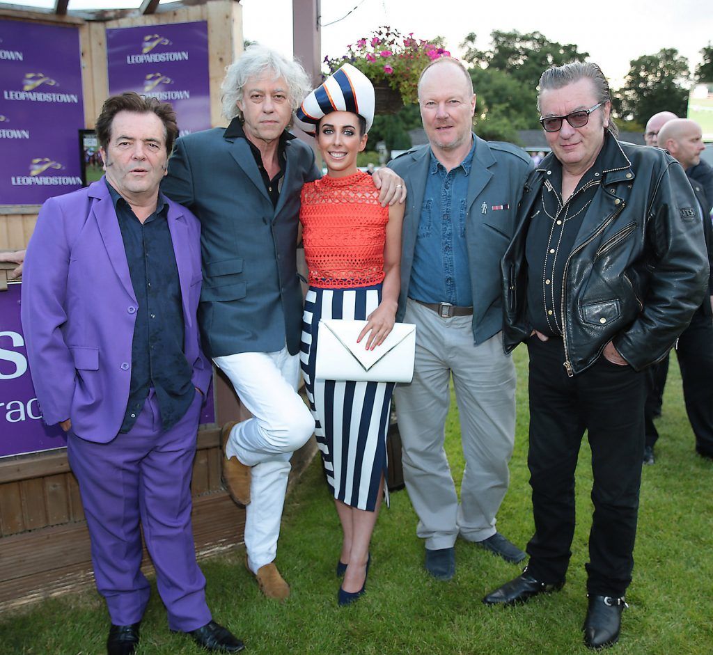 Bob Geldof  and members of The Boomtown Rats congratulate winner of best dressed Bernadette Ni Chadhain from Galway at the final of The Beacon Hotel's  Dare to be Different Best Dressed Competition at The Leopardstown Evening Race meeting. (Photo by Brian McEvoy)