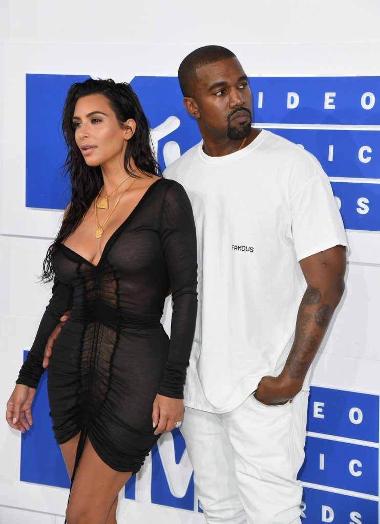 Kim Kardashian and Kanye West arrive for the 2016 MTV Video Music Awards August 28, 2016 at Madison Square Garden in New York. / AFP / Angela Weiss        (Photo credit should read ANGELA WEISS/AFP/Getty Images)