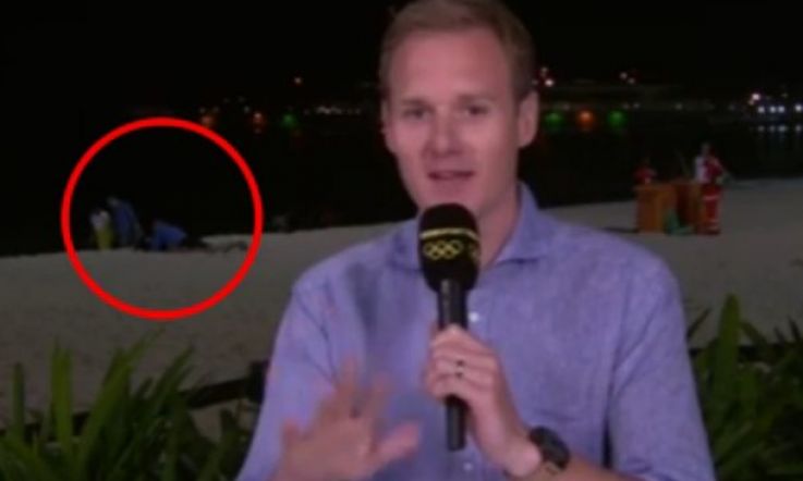 Awkward. BBC News reporter is interrupted by couple 'having sex' on the beach in Rio