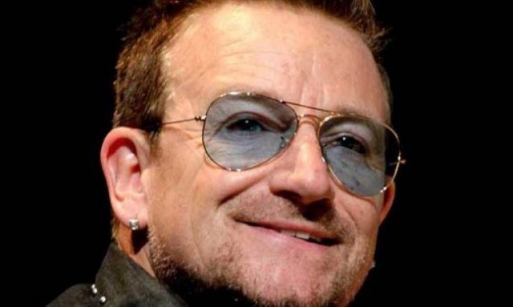 See Bono's cool kids pose for a moody photo outside his childhood home