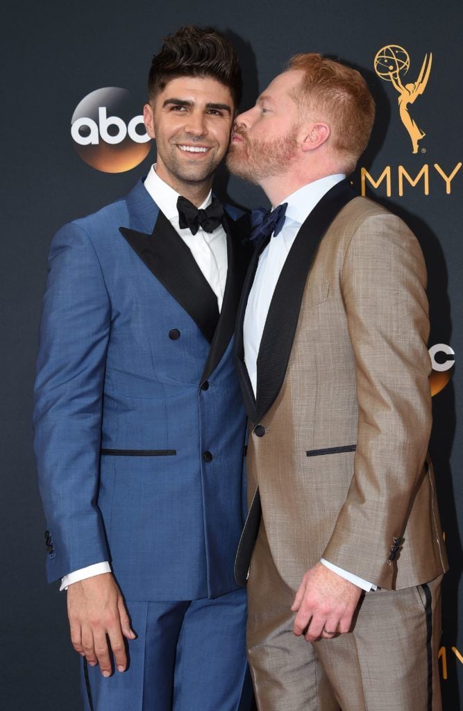 Jesse Tyler Ferguson (R) and Justin Mikita arrive for the 68th Emmy Awards on September 18, 2016 at the Microsoft Theatre in Los Angeles.  / AFP / Robyn Beck        (Photo ROBYN BECK/AFP/Getty Images)
