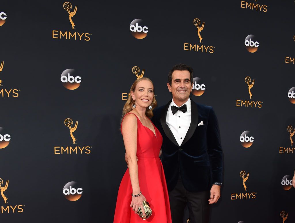 Ty Burrell (R) and spouse Holly Burrell arrive for the 68th Emmy Awards on September 18, 2016 at the Microsoft Theatre in Los Angeles.  / AFP / Robyn Beck        (Photo  ROBYN BECK/AFP/Getty Images)