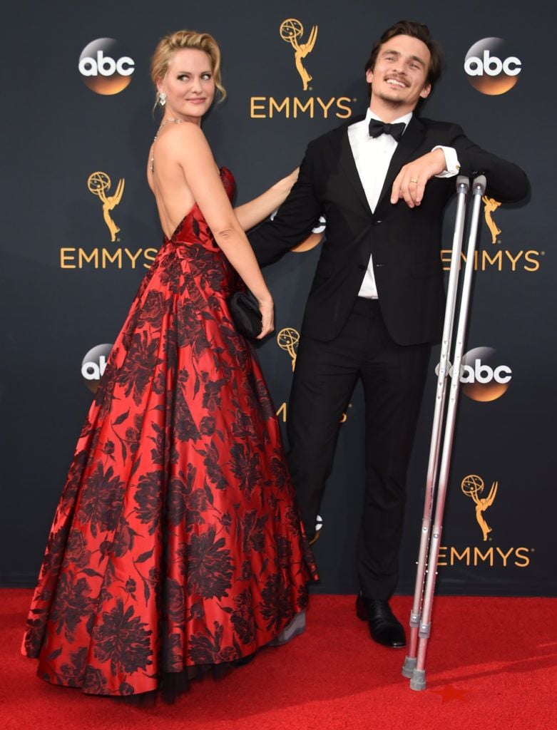 Actor Rupert Friend (R) and Aimee Mullins  arrive for the 68th Emmy Awards on September 18, 2016 at the Microsoft Theatre in Los Angeles.  / AFP / Robyn Beck        (Photo ROBYN BECK/AFP/Getty Images)