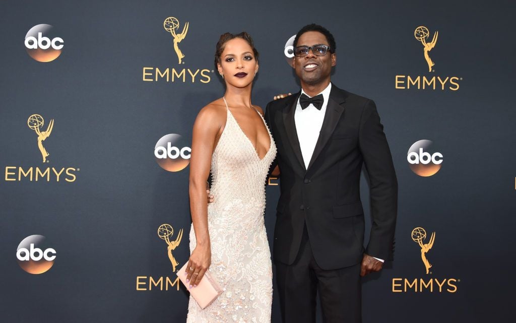 Chris Rock (R) and Megalyn Echikunwoke arrive for the 68th Emmy Awards on September 18, 2016 at the Microsoft Theatre in Los Angeles.  / AFP / Robyn Beck        (Photo ROBYN BECK/AFP/Getty Images)