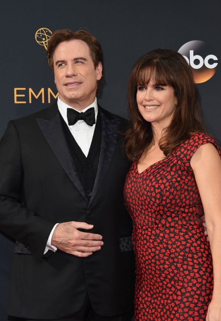 John Travolta (L), and Kelly Preston arrive for the 68th Emmy Awards on September 18, 2016 at the Microsoft Theatre in Los Angeles.  / AFP / Robyn Beck        (Photo credit should read ROBYN BECK/AFP/Getty Images)