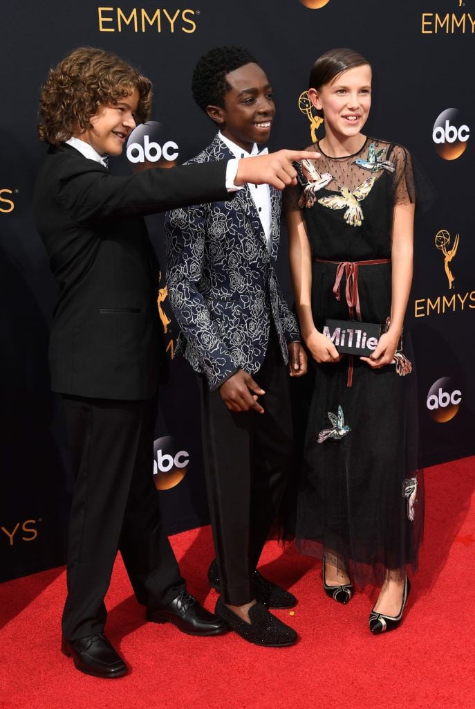 (L-R) Actors Gaten Matarazzo, Caleb McLaughlin and Millie Bobby Brown attend the 68th Annual Primetime Emmy Awards at Microsoft Theater on September 18, 2016 in Los Angeles, California.  (Photo by Frazer Harrison/Getty Images)