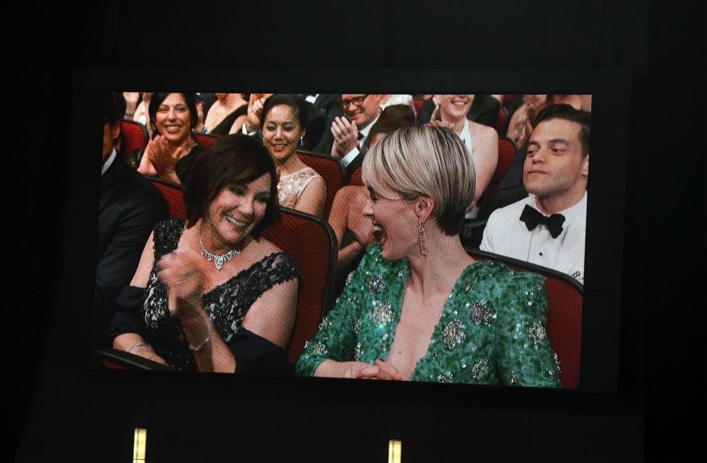 Prosecutor Marcia Clark (L) and actress Sarah Paulson seen on video screen during the 68th Annual Primetime Emmy Awards at Microsoft Theater on September 18, 2016 in Los Angeles, California.  (Photo by Kevin Winter/Getty Images)