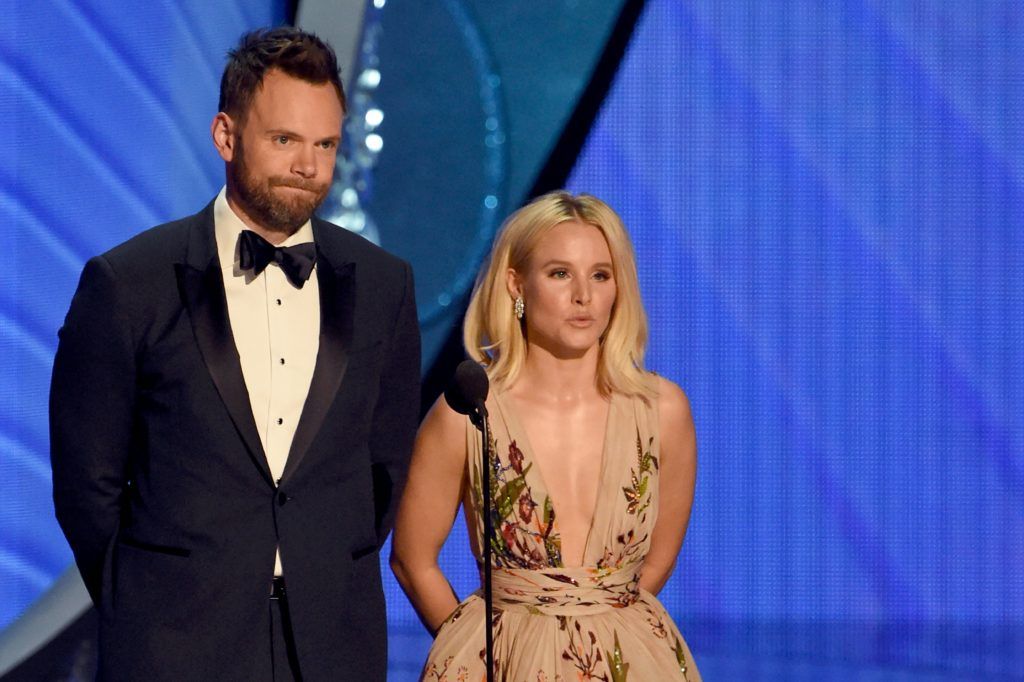 Actors Joel McHale and Kristen Bell speak onstage during the 68th Emmy Awards show on September 18, 2016 at the Microsoft Theatre in downtown Los Angeles.  / AFP / Valerie MACON        (PhotoVALERIE MACON/AFP/Getty Images)