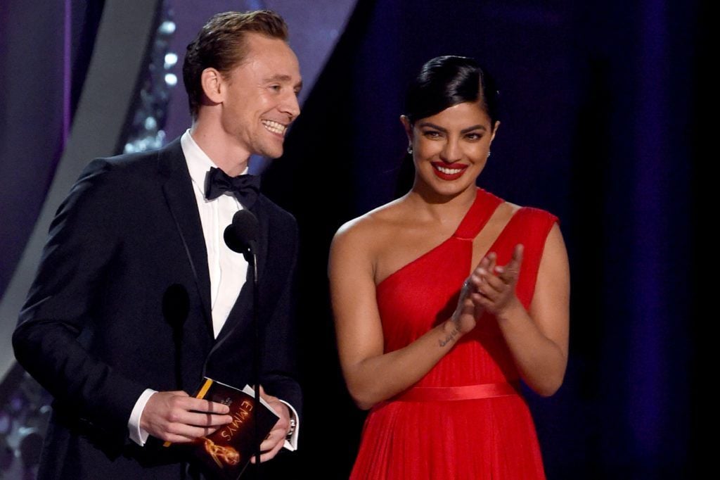 Actors Priyanka Chopra (R) and Tom Hiddleston take part during the 68th Emmy Awards show on September 18, 2016 at the Microsoft Theatre in downtown Los Angeles.  / AFP / Valerie MACON        (Photo VALERIE MACON/AFP/Getty Images)