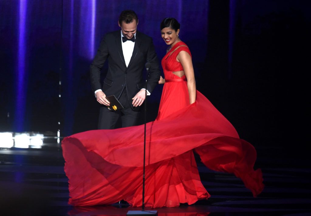 Actors Tom Hiddleston and Priyanka Chopra speak onstage during the 68th Annual Primetime Emmy Awards at Microsoft Theater on September 18, 2016 in Los Angeles, California.  (Photo by Kevin Winter/Getty Images)