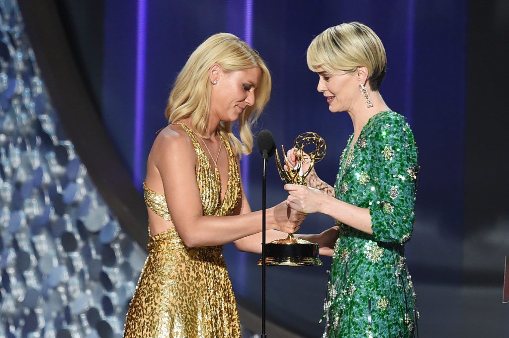Actress Sarah Paulson (R) accepts Outstanding Lead Actress in a Limited Series or Movie for 'The People v. O.J. Simpson: American Crime Story' from actress Claire Danes onstage during the 68th Annual Primetime Emmy Awards at Microsoft Theater on September 18, 2016 in Los Angeles, California.  (Photo by Kevin Winter/Getty Images)