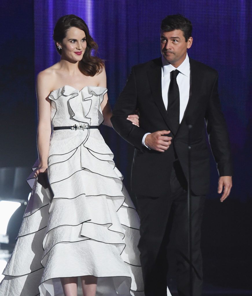 Actors Michelle Dockery (L) and Kyle Chandler speak onstage during the 68th Annual Primetime Emmy Awards at Microsoft Theater on September 18, 2016 in Los Angeles, California.  (Photo by Kevin Winter/Getty Images)